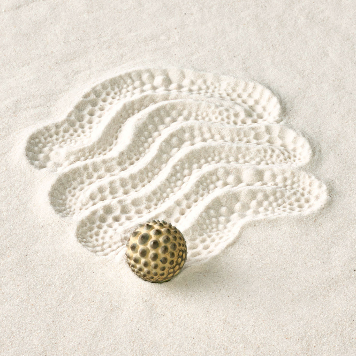 epic sand art made with textured sand sphere